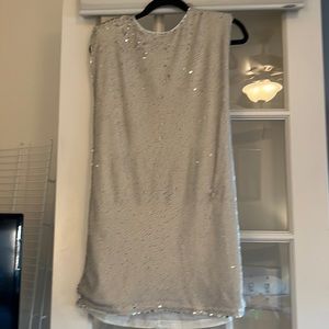 Full sequin white shift dress.
